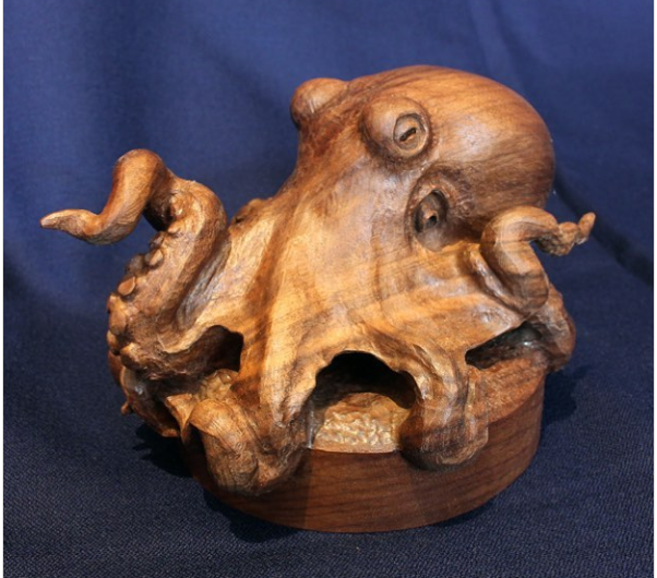 A beautiful hand-digging an animal statue