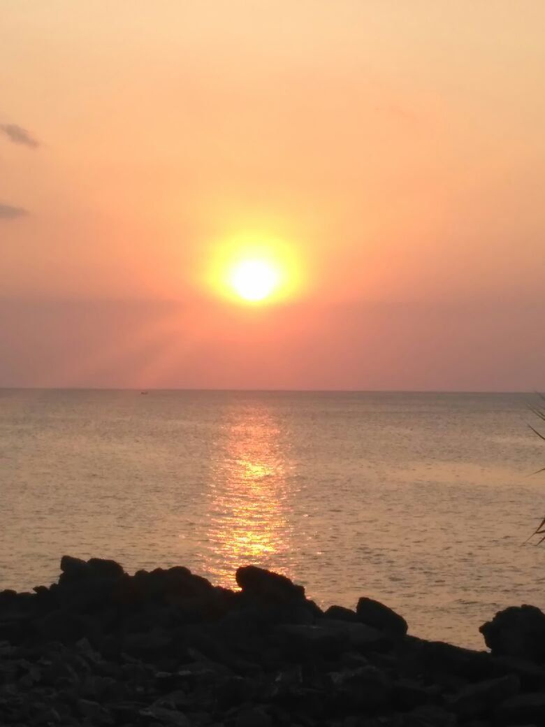 sunset at lhoknga aceh beach / sunset di pantai lhoknga aceh