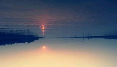 sunset in reality but seems sunrise on  reflection 