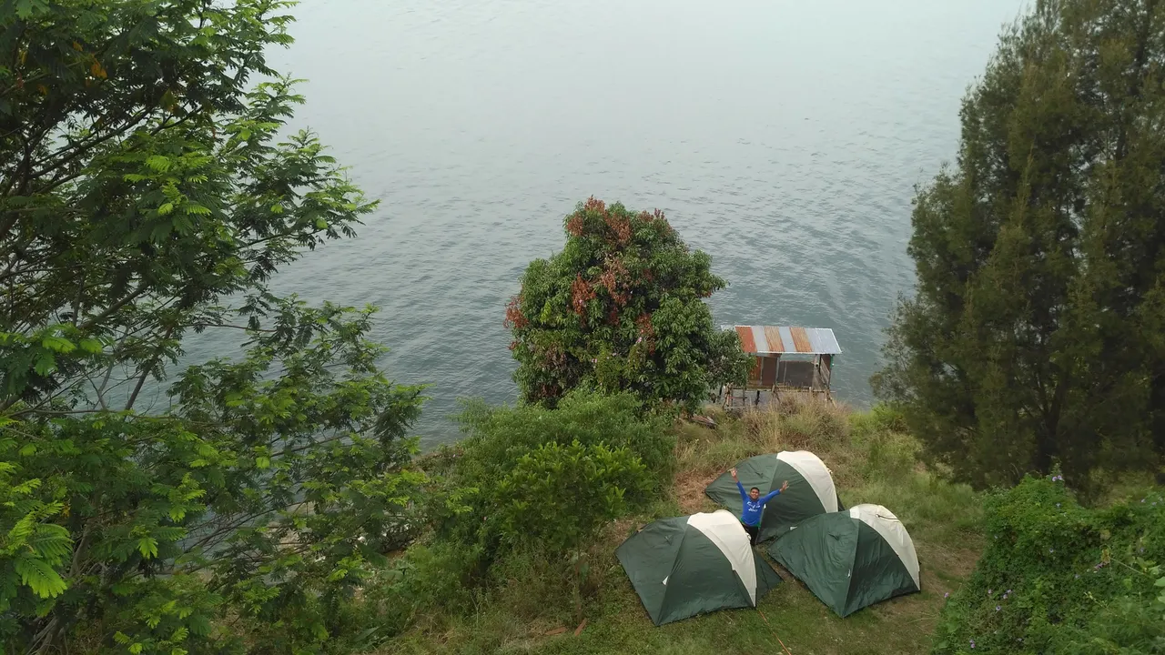 Camper on the edge of a freshwater lake