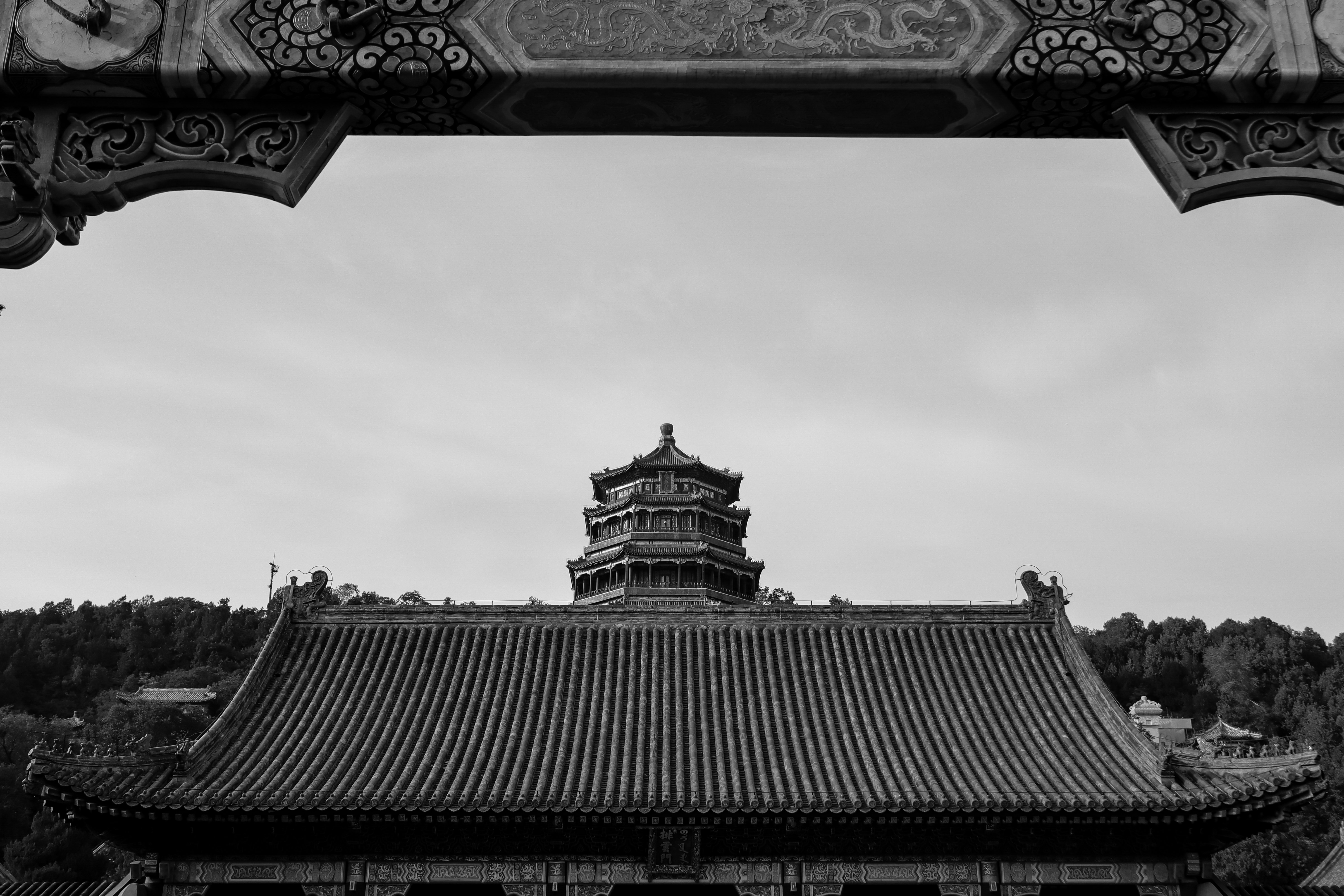 roof_of_a_chinese_temple_with_pagoda_in_the_background.jpg