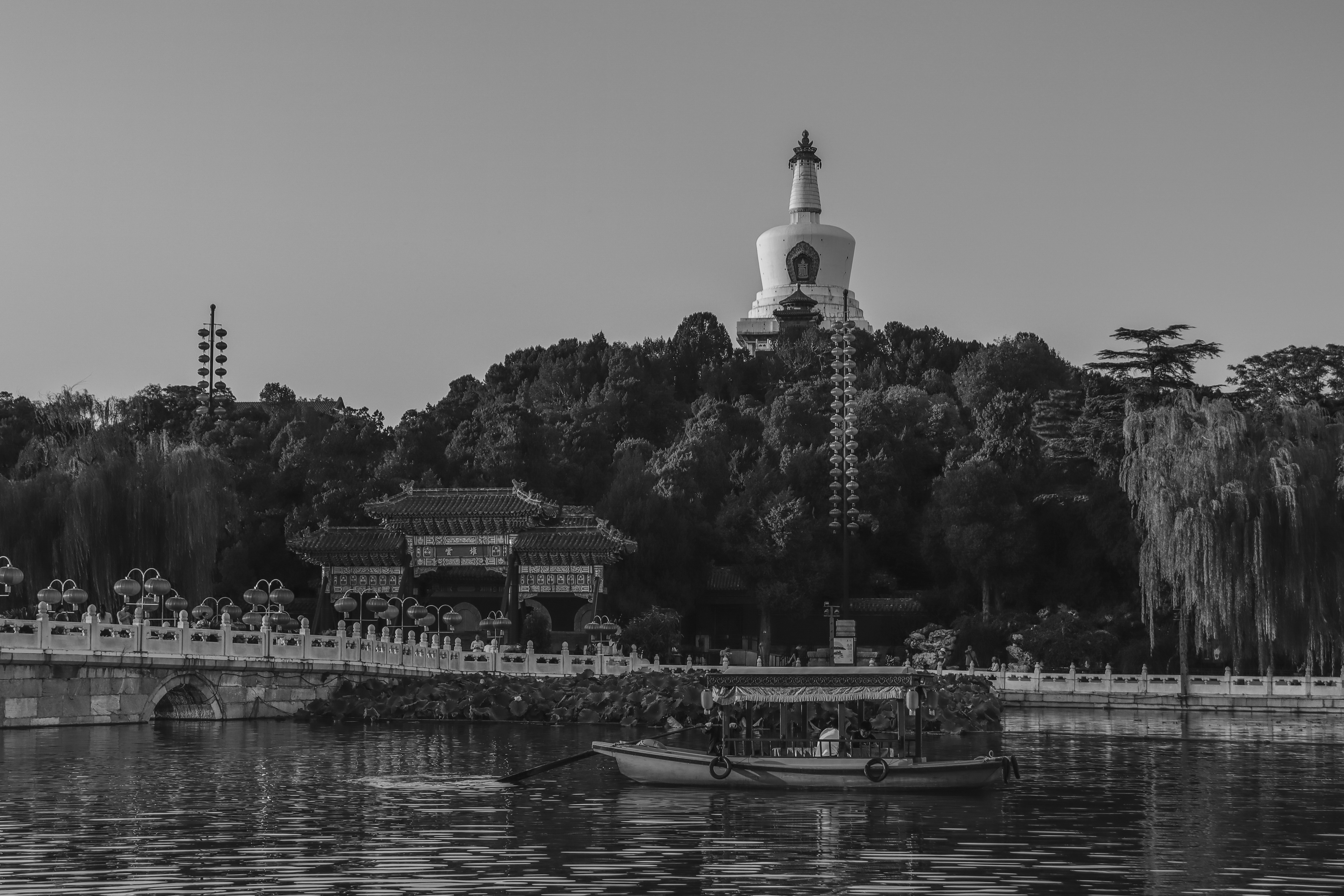 tranquil_lake_at_sunset_time_with_a_pagoda_in_the_background_2.jpg