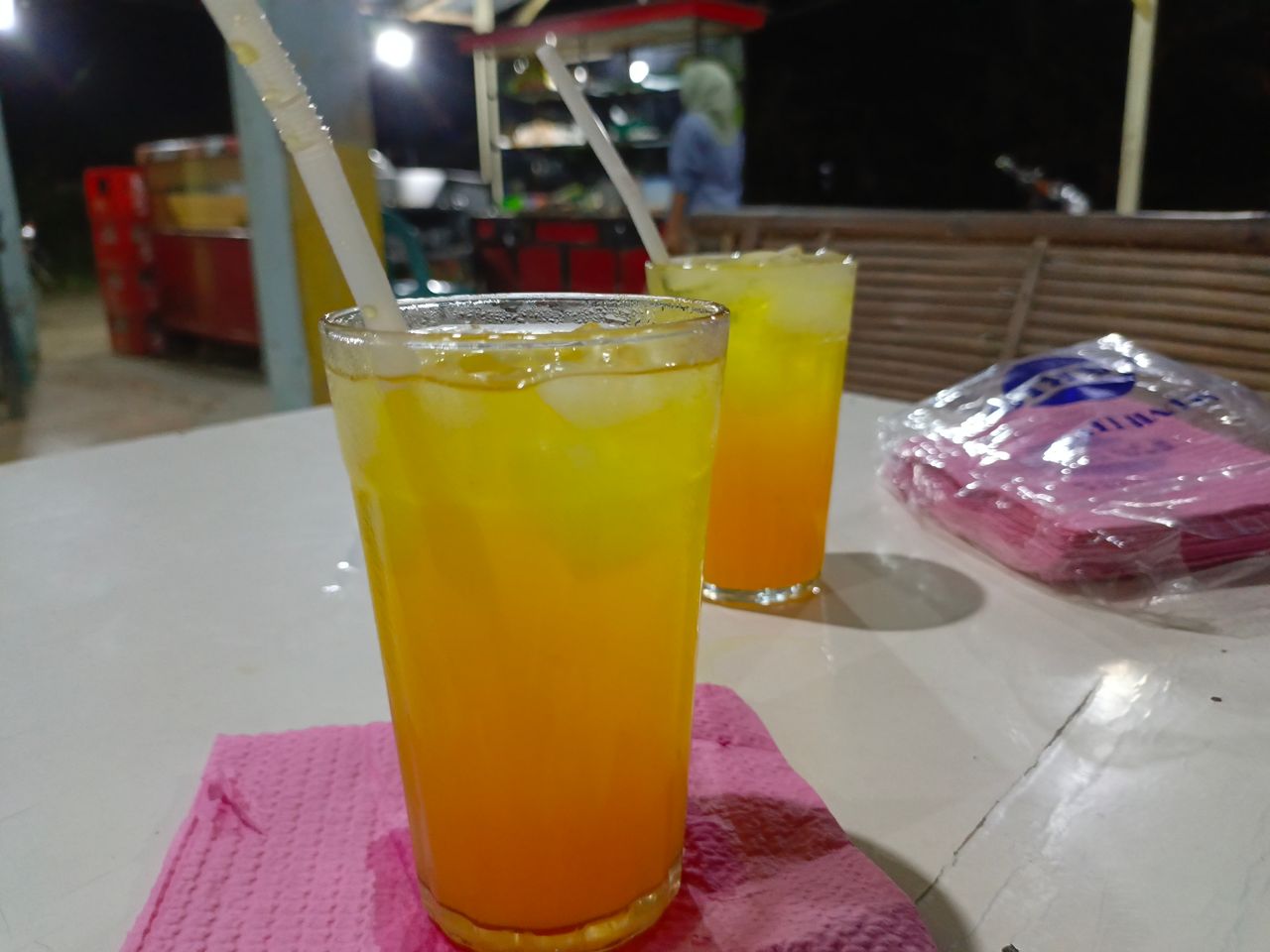 Eating noodles at a food stall