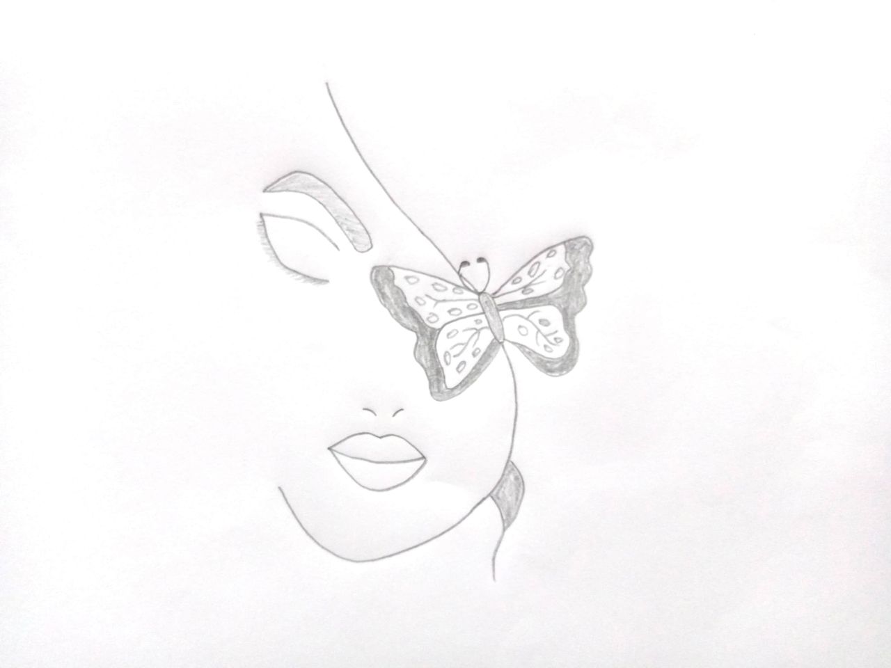Beautiful butterfly on a girl's face