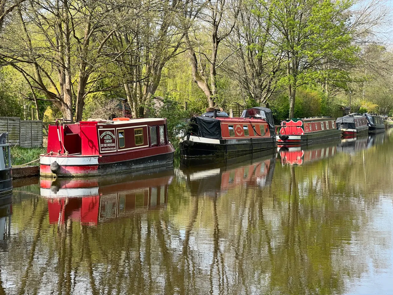 Narrowboats and a horse drawn boat