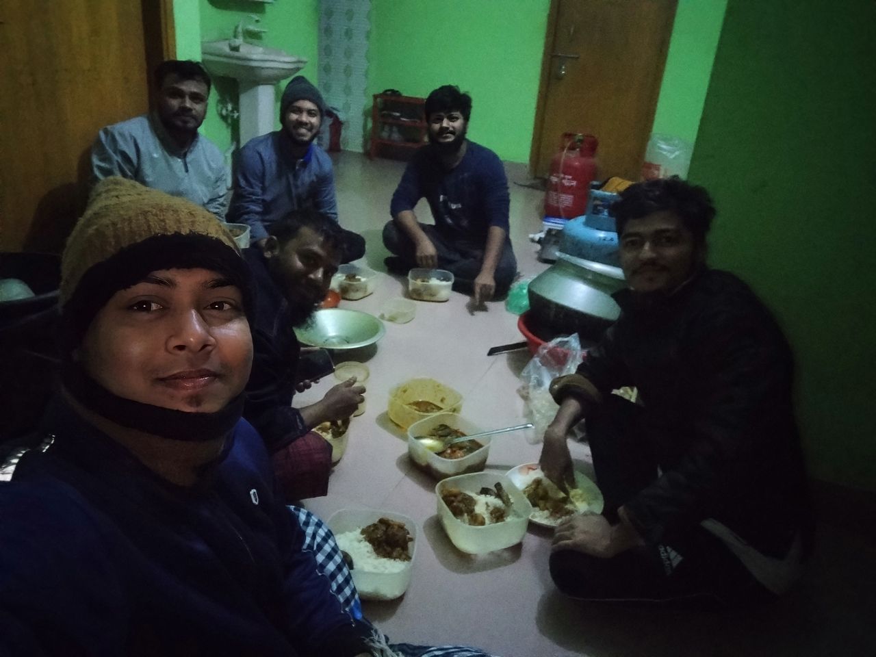 Eating and drinking with friends on a winter night.