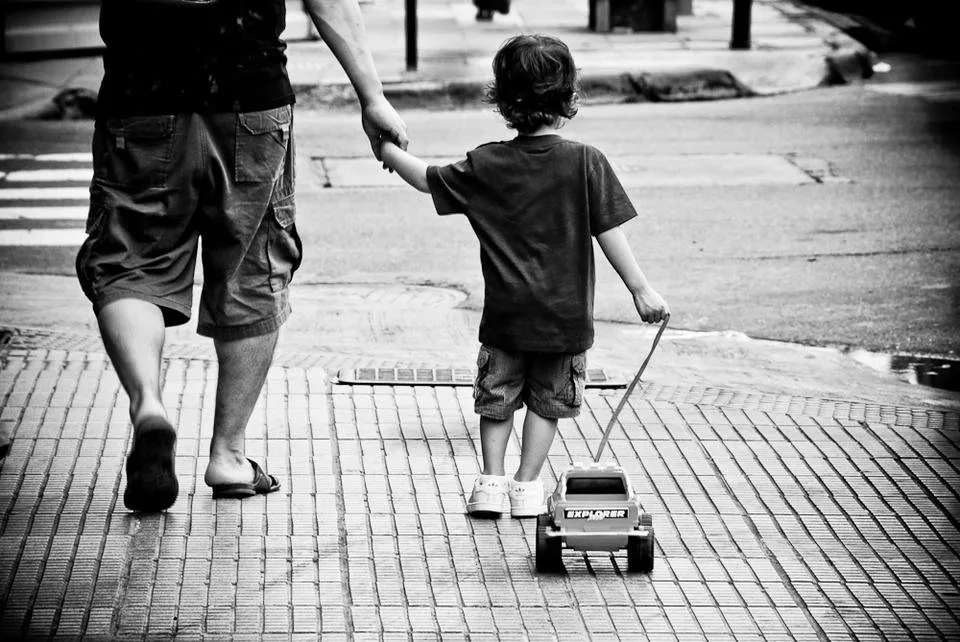 father_son_and_plastic_truck_by_anahuac.jpg
