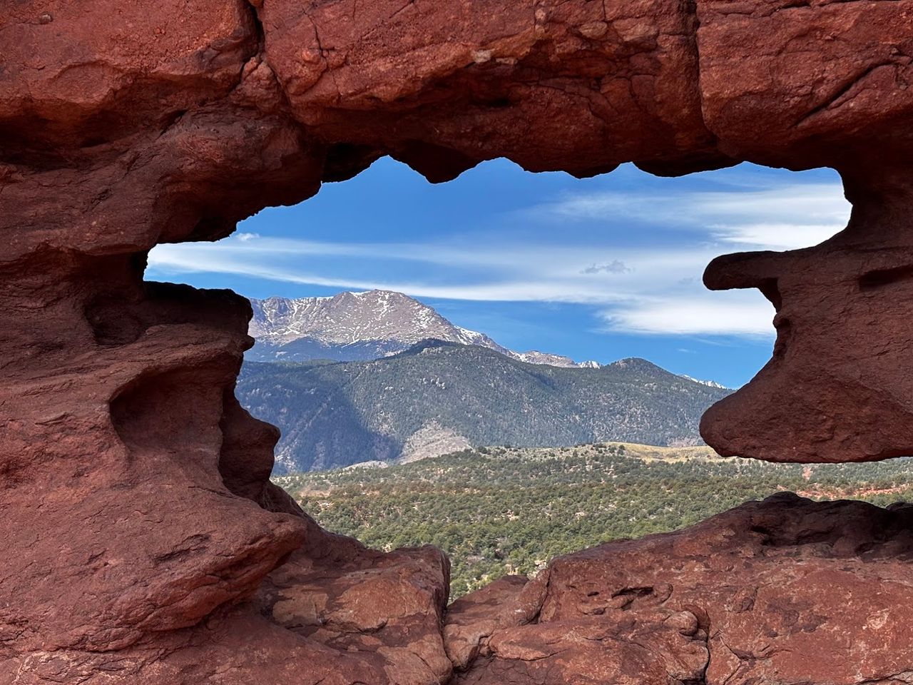 Garden of the gods. A red rock window with a view of Pikes Peak (Rocky Mountains). Colorado Springs, Colorado